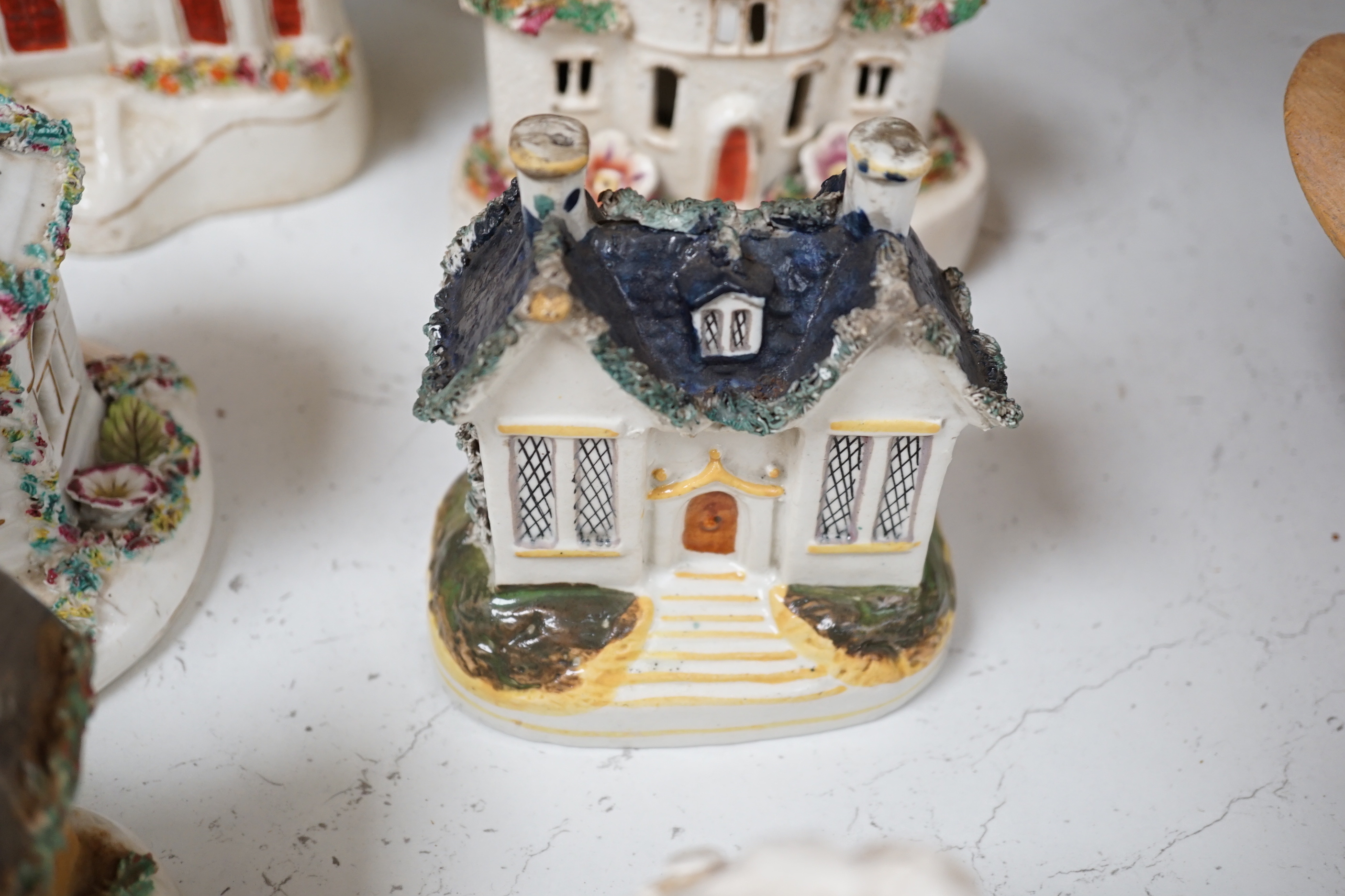 Thirteen Staffordshire 'cottage’ pastille burners or models